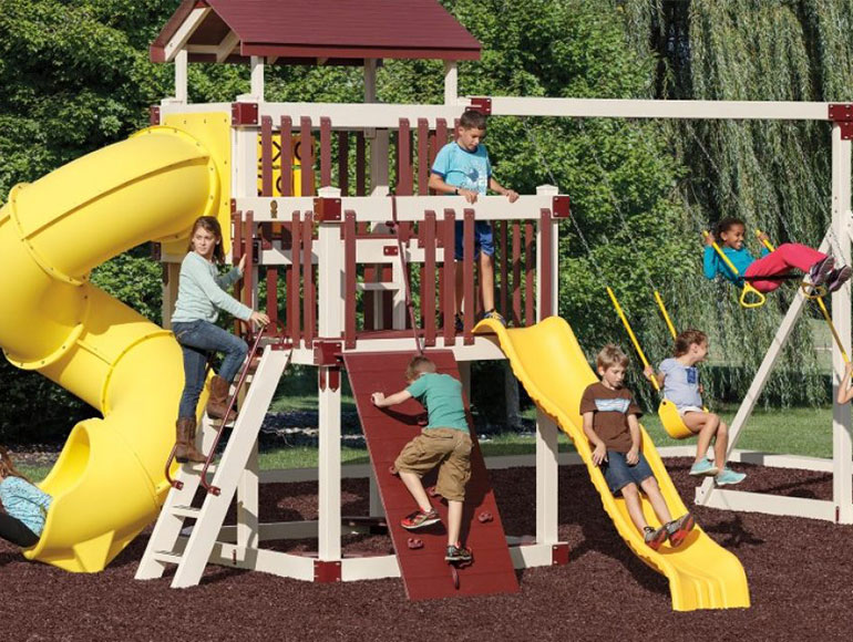 kids playing on vinyl playground equipment and swingset